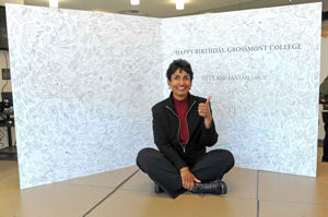 Grossmont College President Sunny Cooke gives thumbs up sign by card with 1,797 signatures.
