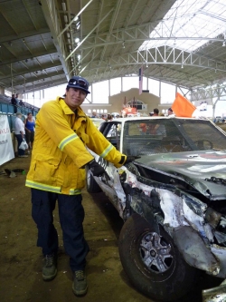 Viejas driver Pablo Caballeros poses with what's left of his vehicle