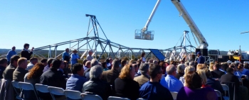 Top of Powerlink tower dwarfs crowd.