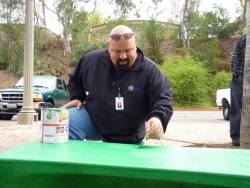 Councilman Arapostathos adds fresh paint to a park bench during clean-up day at La Mesita Park.