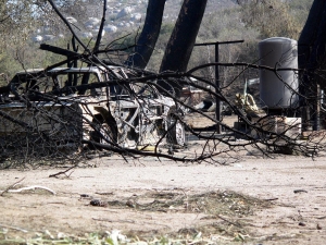 A charred car near the Lytle home